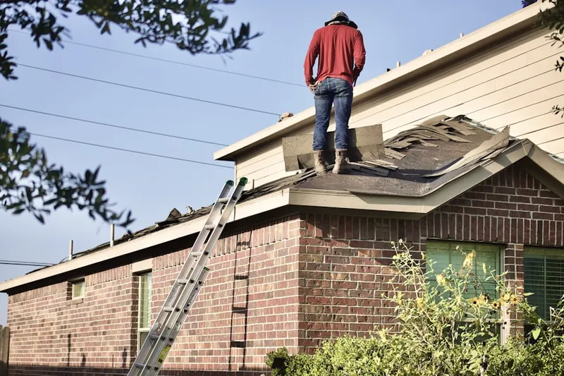 Professional roofer working on a residential roof in Walnut Farms